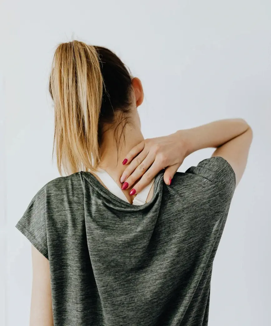Young woman has neck pain